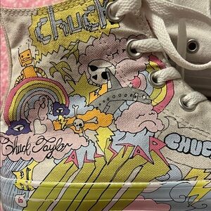 Converse Chuck Taylor High-Tops with notebook cartoon graphics